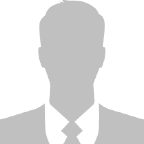 Todd-headhsot-highres a man in a suit and tie